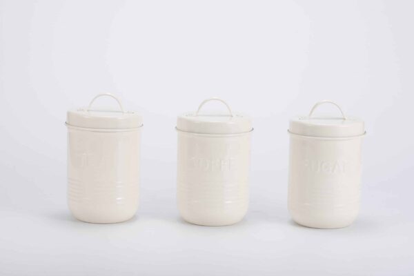 Organized kitchen with galvanized iron canister and bread bin set.