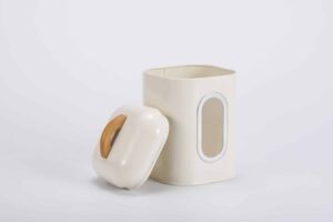 White Tea Coffee Sugar Canisters with clear viewing windows and wooden handles on a kitchen shelf