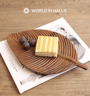 Leaf-shaped walnut wooden tray with carved texture
