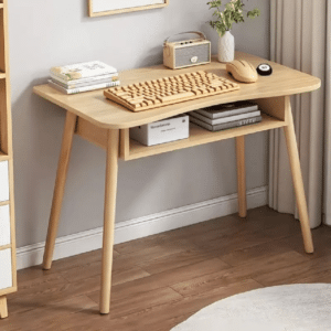 Bamboo wireless mouse beside a laptop on a wooden table