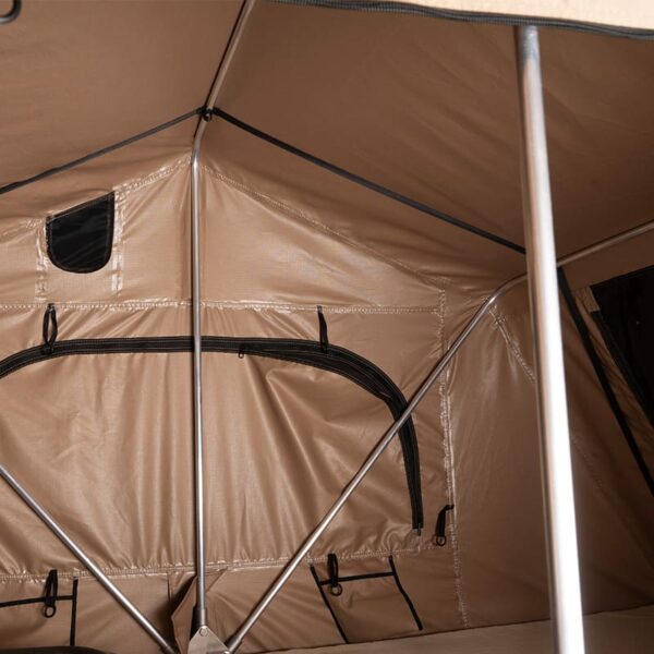 A beige and grey roof top tent with an extended awning, featuring a large window